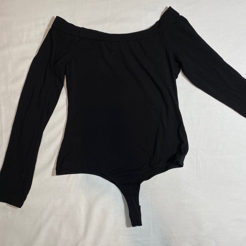 Black body suit off the shoulders